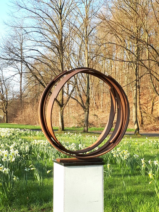 Abstract metal sculpture on a pedestal