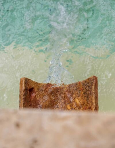 Detail of water spout feeding the stone pool