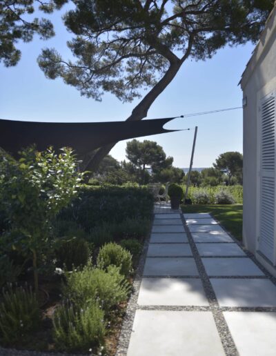 After view of the garden path with stone pavers, integrated into a structured landscaped garden