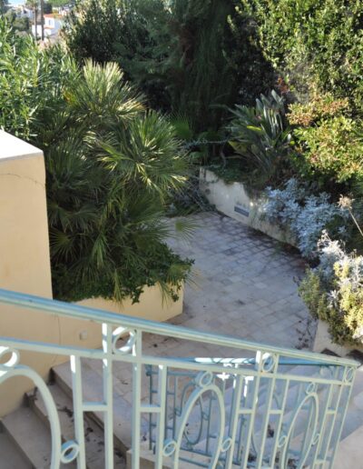 Renovated secondary staircase opening onto a redesigned garden
