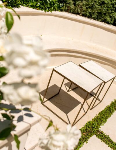 Built-in stone bench on an elegant garden terrace