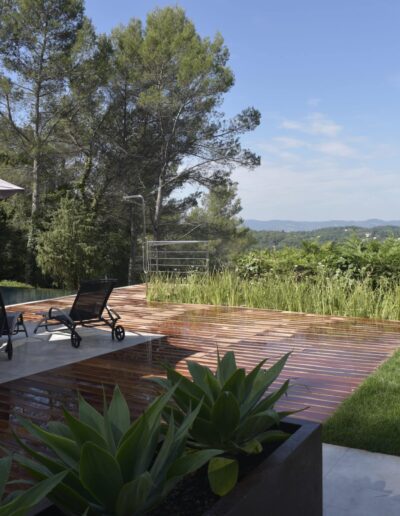 Wooden deck with sunbeds and open valley views
